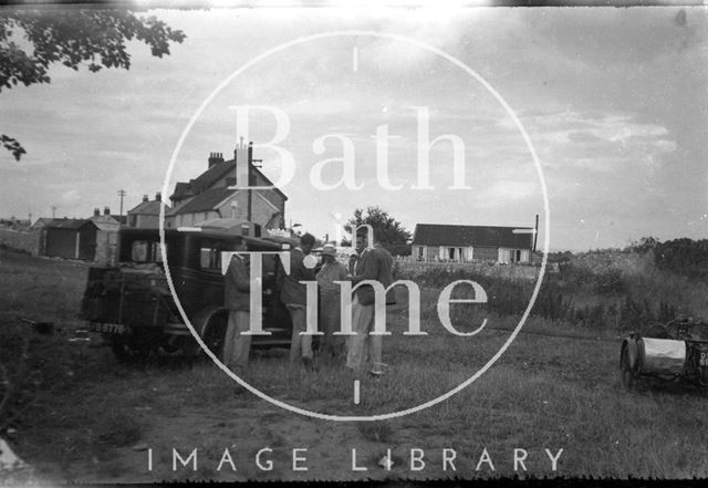 Family group including the photographers wife and son in an unidentified location 1930