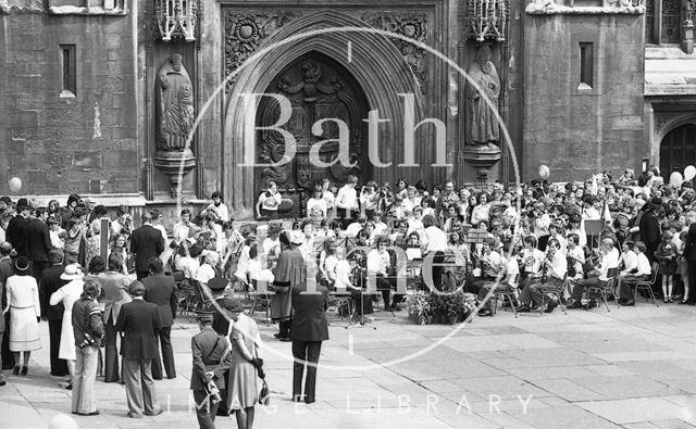 The band awaits the Queen outside Bath Abbey