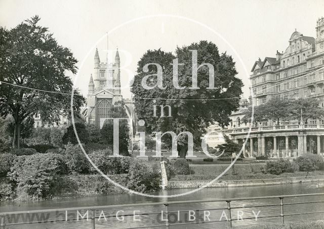 View of Bath Abbey from the River Avon showing the Institution Gardens c.1930