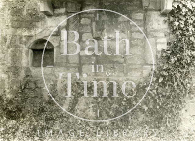 East end of the churchyard wall showing the patron saint, St. Swithun's Church, Bathford c.1890