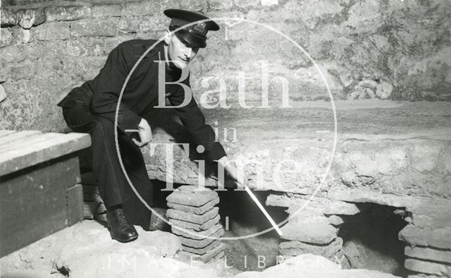 Roman Baths guide showing detail of hypocaust, Bath c.1960?