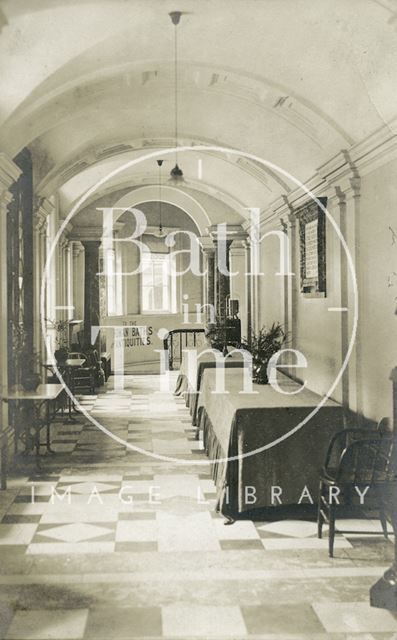 View in the corridor showing entrance to the Roman Baths, Pump Room, Bath c.1920