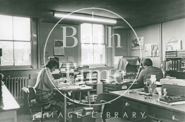 Sandra Davey repairing books and Mary Wills cataloguing and classifying 1989