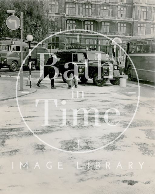 Firemen clean the road in Orange Grove following a chemical spill, Bath c.1960