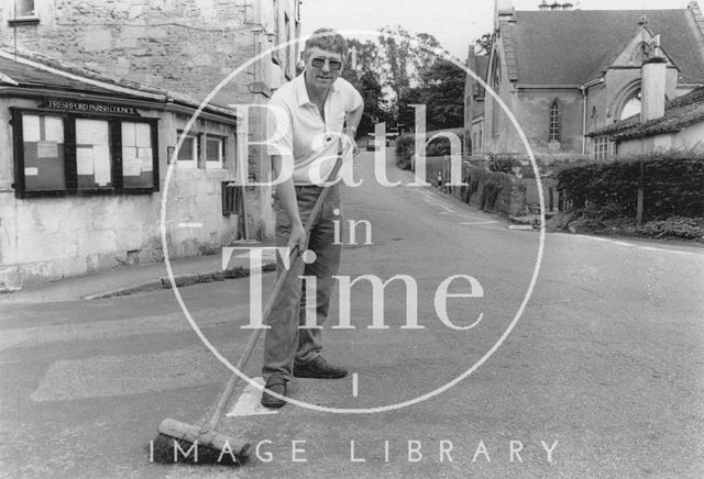 Roland Birchby sweeping the road in Freshford 1988