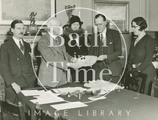 R.W.M. Wright presented with a silver salver for 25 years' service with the Bath Libraries, presented by Ald. T. Sturge Cotterell 1933