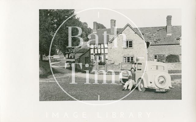 One of the photographer's twin boys and their car at Kilpeck, Herefordshire c.1930