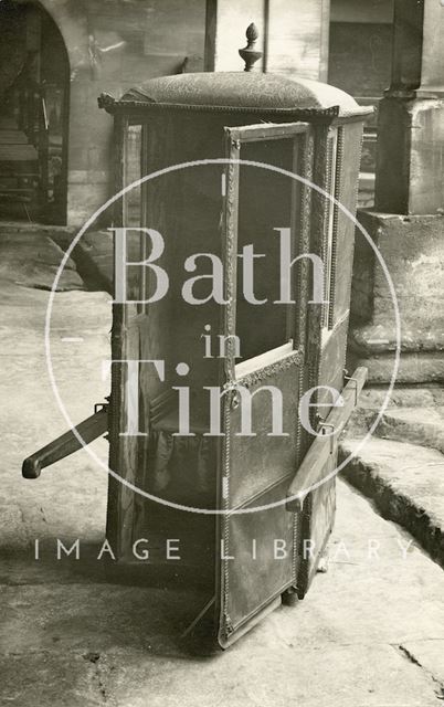 An original sedan chair at the Roman Baths, Bath c.1920