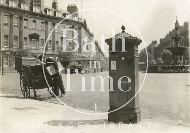 A postman delivering a parcel at Laura Place, Bath c.1930