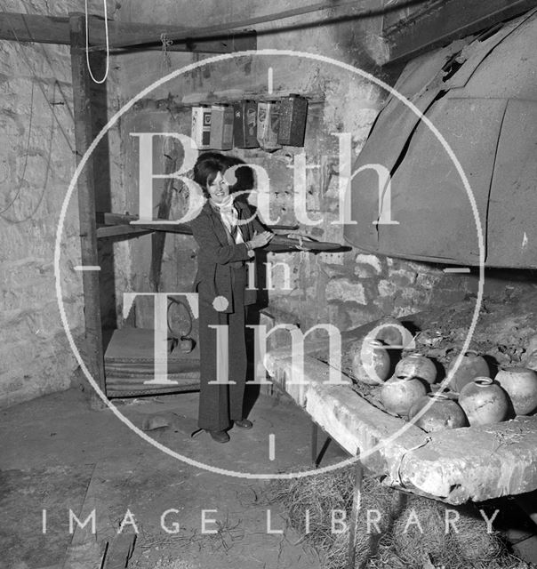 Jane Perry-Smith beside an old forge, soon to be her new boutique 11, Beauford Square, Bath 1973