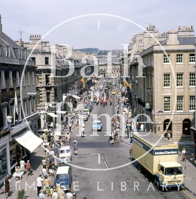 A procession down Milsom Street, Bath led by a panda car 1977