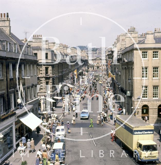 A procession down Milsom Street, Bath led by a panda car 1977