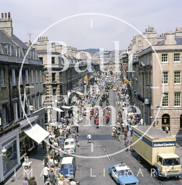 A procession down Milsom Street, Bath led by a panda car 1977