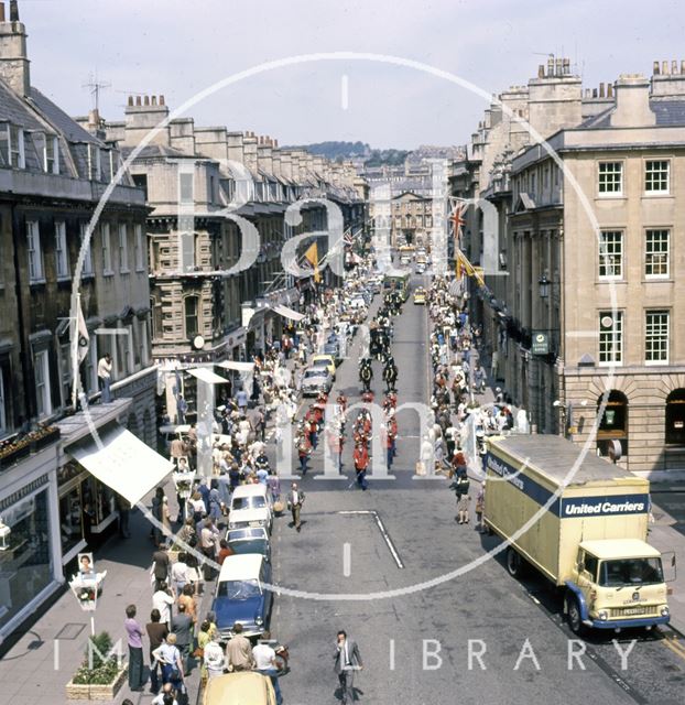 A procession down Milsom Street, Bath led by a panda car 1977