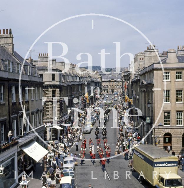 A procession down Milsom Street, Bath led by a panda car 1977