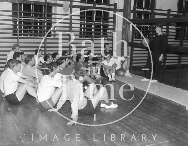 Bath City football club training talk in the gym c.1963