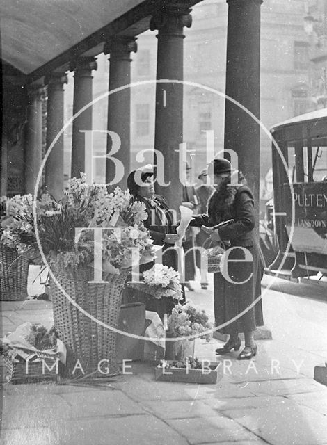 Mrs. Davis, flower seller under the colonnade, Stall Street, Bath c.1940?