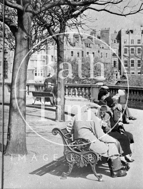 Gentlemen sitting on benches on Grand Parade, Bath c.1940?