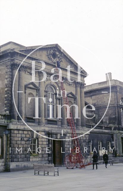 Inspecting the stone pediment of the Roman Baths, Abbey Church Yard, Bath c.1965