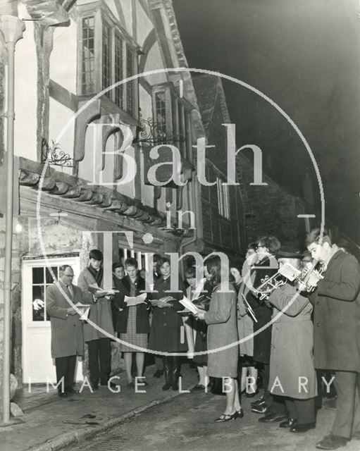 Carol singers outside the Sign of the Angel Guest House, Lacock, Wiltshire 1965