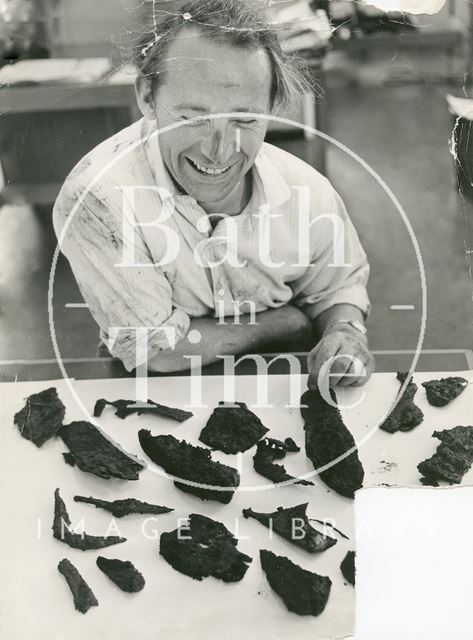 Curator of the Roman Baths Michael Owen with finds from the archaeological dig in Walcot Street, Bath 1971