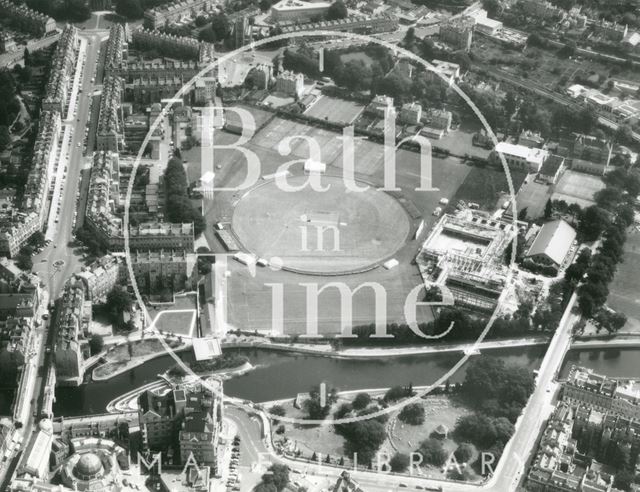 Aerial photograph of Bath from the east showing the Recreation Ground being used for cricket. The Sports Centre is being built to the right 1974