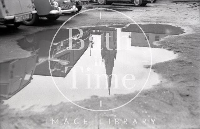 Reflection of St. John's Catholic Church in a puddle, Bath c.1970