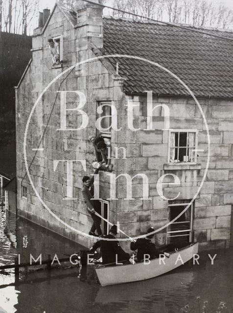 Police rescuing flood-trapped residents, 1, Yewmead Cottages, Brassmill Lane, Bath 1960