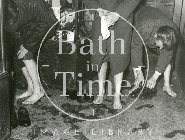 Taking off shoes and socks to cope with the Bath Floods, Bath 1960