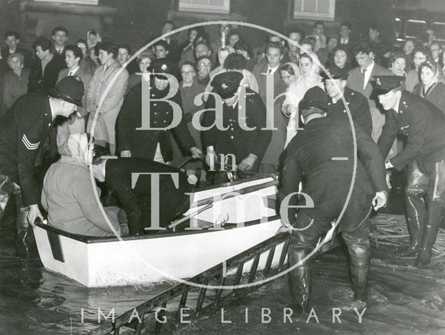 The police rescuing a lady in a rowing boat during the Bath Floods, Bath 1960