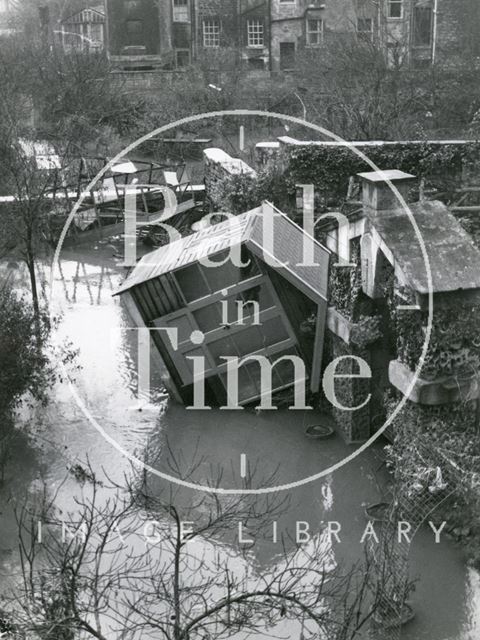 A summer house lies on its side next to Delia's Grotto, North Parade, Bath 1960