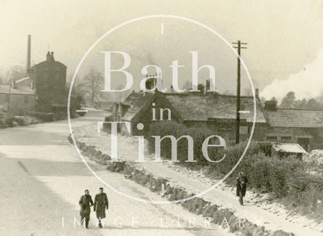 Men walking on the frozen Kennet and Avon Canal by the George Inn, Bathampton c.1930