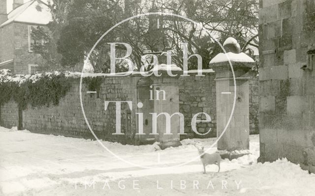 A dog outside the entrance to Harbutt's Plasticine Works, Bathampton 1930s