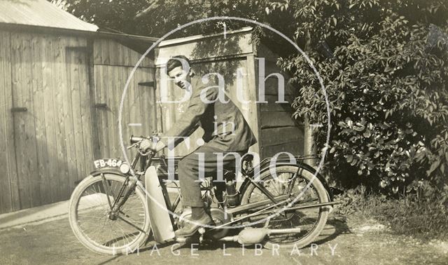 A young man posing on a 1925 New Imperial motorcycle