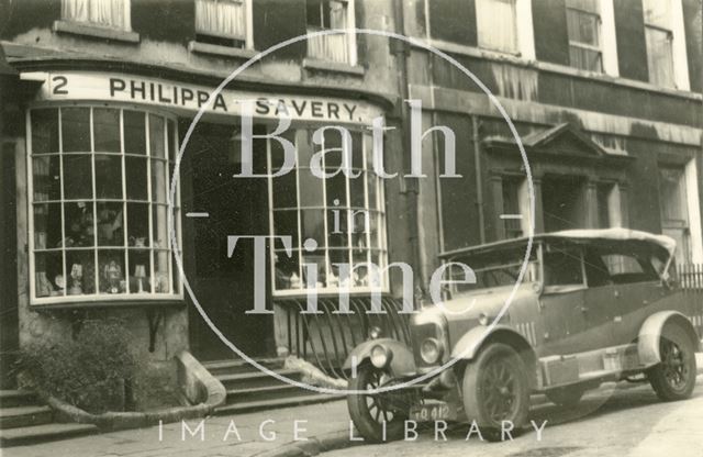 An elegant car outside Philippa Savery, antiques, 2, Abbey Street, Bath c.1945