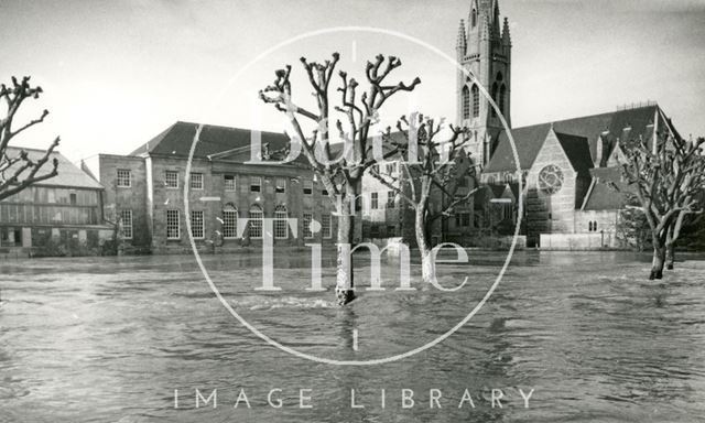 View across the flooded River Avon towards St. John's Church from Ferry Lane, Bath 1960