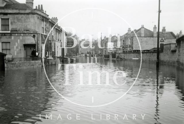 The flooded Pulteney Road from the end of Caroline Buildings, Bath 1960