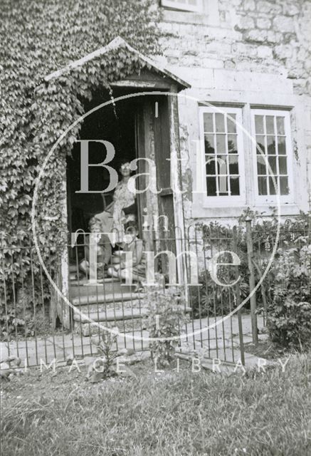 A family group outside Charlcombe Farm House, Charlcombe near Bath 1948