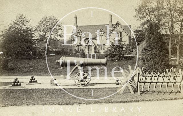 A cannon and the dairy at the entrance to Royal Victoria Park, Bath 1867