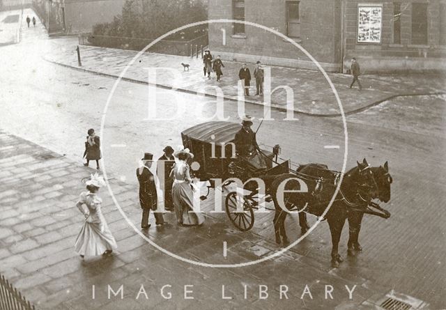 An elegant group of people prepare to get into a horse-drawn coach opposite Green Park Station, Bath c.1900