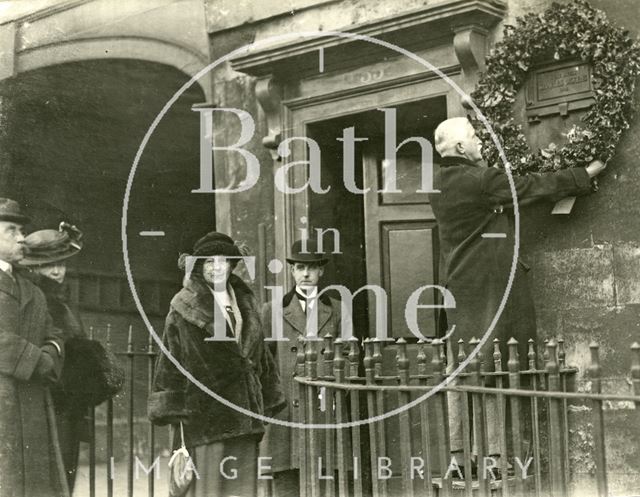 Mr. T.S. Cotterell placing a wreath on Dickens' Plaque in Bath 1922