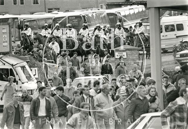 Mounted police keep watch on football fans at Twerton Park, Bath 1990