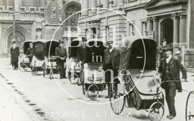 Bath chairs outside the Pump Room in Abbey Church Yard, Bath c.1907