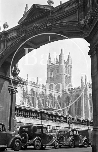 The classic view of Bath Abbey from under the arch in York Street c.1950