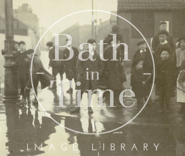 Children on Lower Bristol Road stand beside the flooded road, Bath c.1914