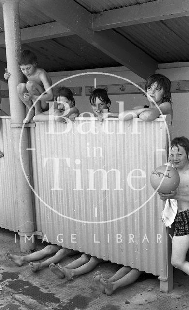 Swimmers by the changing screen at the Cleveland Baths, Bath 1978