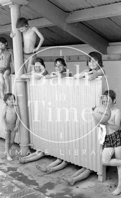 Swimmers by the changing screen at the Cleveland Baths, Bath 1978