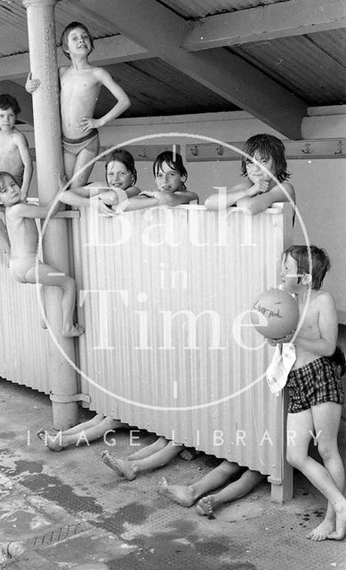 Swimmers by the changing screen at the Cleveland Baths, Bath 1978